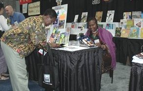 
 Ifeoma signs a book for a US fan of her work
